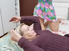 Title: Passionate Kiss Between a Redhead and an Older Woman